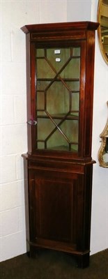 Lot 499 - A glazed mahogany standing corner cupboard