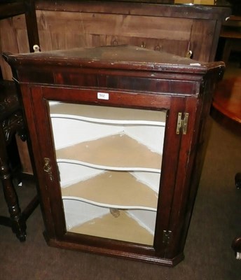 Lot 502 - A glazed Georgian oak straight fronted corner cabinet