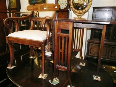 Lot 507 - A mahogany armchair and a Sutherland table