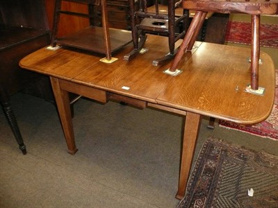 Lot 512 - Oak drop leaf dining table