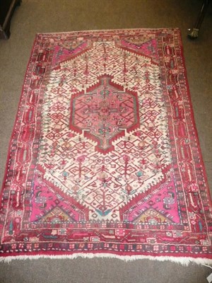 Lot 525 - A West Persian Village rug The ivory field centred by a medallion 159 x 106 cm