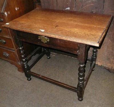 Lot 526 - An oak single drawer table