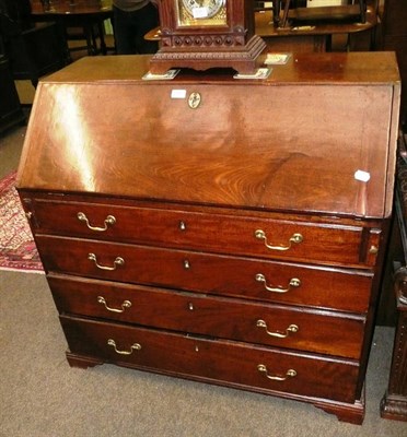 Lot 534 - A Georgian mahogany bureau