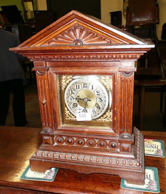 Lot 535 - A oak striking mantel clock