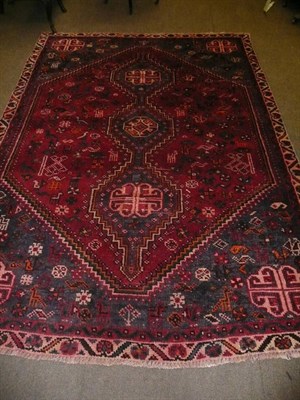 Lot 536 - Shiraz rug south west Persia, the raspberry lozenge field of animals birds and flower heads...