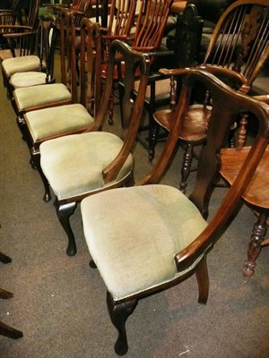 Lot 553 - Two pairs of walnut dining chairs and a side chair with upholstered splat