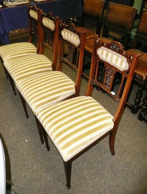 Lot 561 - A set of four carved and inlaid rosewood salon chairs