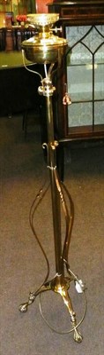 Lot 571 - A brass adjustable standard lamp