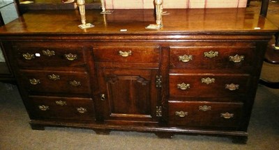 Lot 578 - A George III enclosed oak dresser base