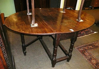 Lot 591 - Late 18th/early 19th century large oak gate leg dining table