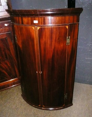 Lot 599 - Mahogany bow front corner cupboard