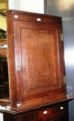 Lot 600 - A Georgian oak straight fronted corner cabinet