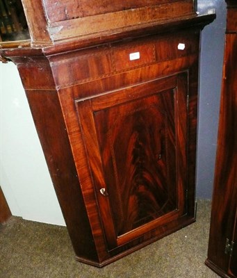 Lot 601 - A Georgian mahogany straight front corner cupboard