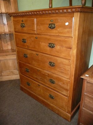 Lot 604 - An early 20th century pine five height chest of drawers