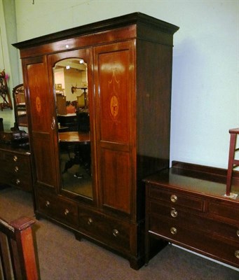 Lot 606 - An Edwardian inlaid mahogany bedroom suit comprising of a wardrobe, chest of drawers, dressing...