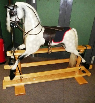 Lot 609 - A modern dapple grey rocking horse