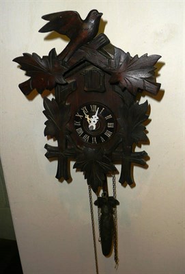 Lot 616 - A cuckoo clock and a gold plated pocket watch