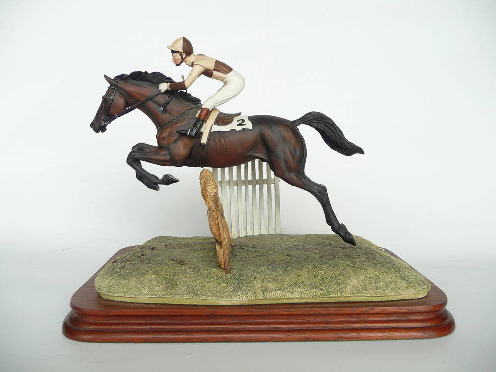 Lot 1034 - Border Fine Arts 'The Hurdler' Bay Thoroughbred and Jockey in brown and cream silks, model No....