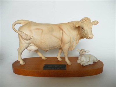 Lot 1064 - Beswick Charolais Cow and Calf on wood plinth, model No. A2648/2652, cream satin matt, 18.4cm high