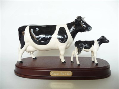 Lot 1068 - Beswick Friesian Cow and Calf on wood plinth, model No. 1362/1249c, black and white gloss, 14cm...