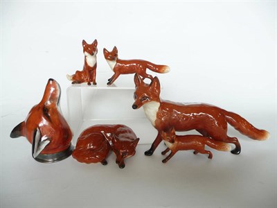 Lot 1083 - Five Beswick Foxes, standing model No. 1016A; lying fox, No. 1017; small seated fox No. 1748;...