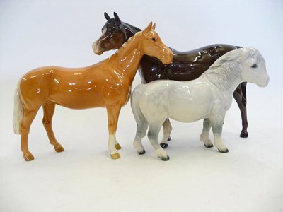 Lot 1093 - Beswick Arab Horse, brown model No. 1771, Huntsman's Horse, palomino model No. 1484, 17.2cm and...