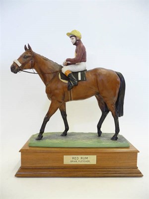 Lot 1099 - An Albany Bisque Porcelain Figure of Red Rum and Brian Fletcher, 1970's, modelled by David...