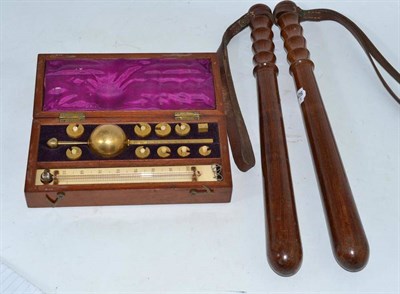 Lot 25 - Sykes hydrometer (cased) and two truncheons