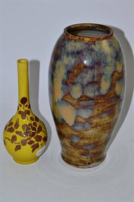 Lot 34 - A Chinese ovoid brown and purple glaze vase and a yellow bottle vase (2)