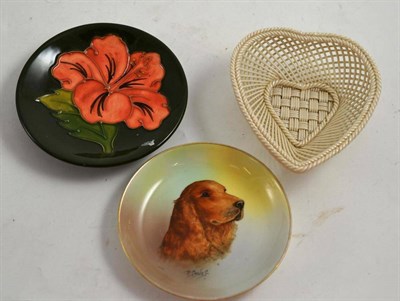 Lot 43 - A Belleek first period four ply heart shape dish, a Moorcroft pin dish and a Minton dog cocker dish