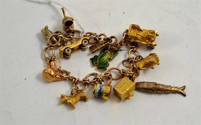 Lot 65 - A fancy link bracelet hung with twelve charms