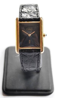 Lot 184 - A Lady's Silver Plated Wristwatch, signed Must de Cartier, circa 1985, quartz movement, black dial