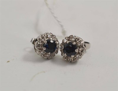 Lot 99 - A pair of sapphire and diamond set earrings