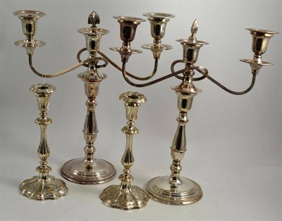 Lot 108 - A pair of silver plated candlesticks and a pair of silver plated candelabrum