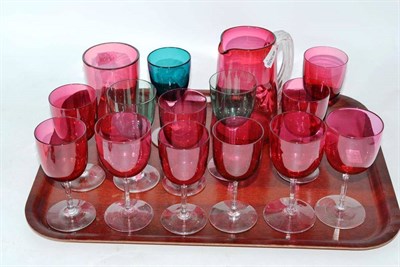 Lot 110 - Cranberry glass jug, eleven glasses and three wine glasses