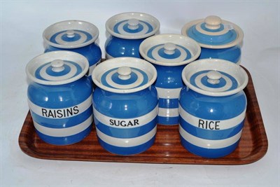 Lot 111 - Seven T & G Green named blue and white striped storage jars and covers