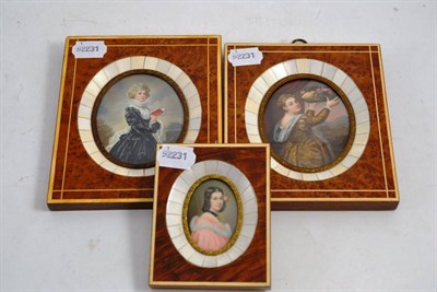 Lot 134 - Amboyna and ivory framed miniature of a young girl holding a plate of fruit, and two others...