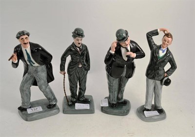 Lot 137 - Four Doulton figures - Charlie Chaplin HN2771, Groucho Marx HN2777, Oliver Hardy HN2775 and...