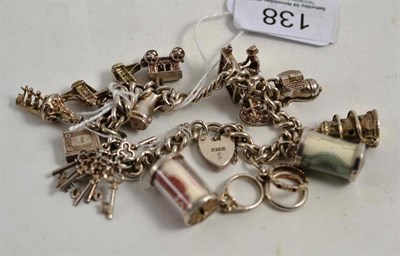 Lot 138 - Silver bracelet suspending thirteen charms with six articulated examples