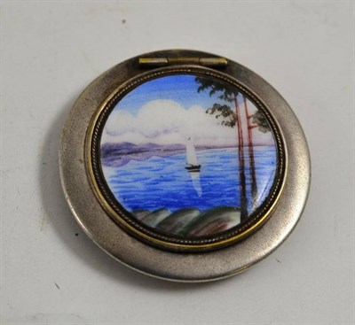 Lot 139 - Circular metal compact, hinged lid decorated with painted enamel roundel