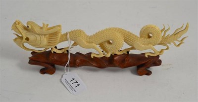 Lot 171 - A carved ivory Chinese dragon (pre-1950)