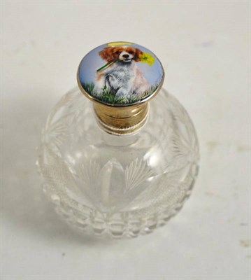 Lot 192 - Cut glass scent bottle with enamel dog painted silver top