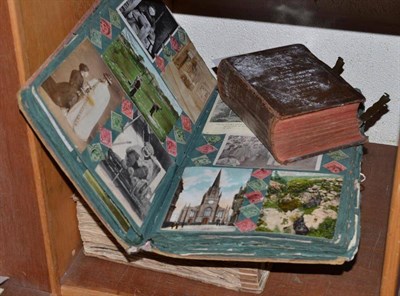 Lot 210 - Two albums of assorted postcards and scraps and a prayer book (3)