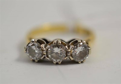 Lot 247 - A diamond three stone ring, in 18ct gold shank 1975