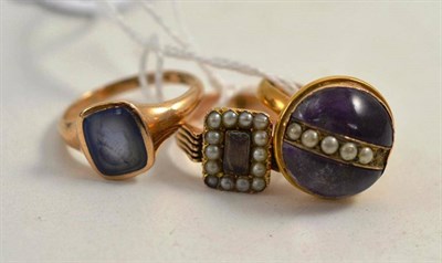 Lot 263 - A 22ct gold band ring with amethyst and seed pearl applied (a.f.), an intaglio ring and a...