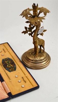 Lot 272 - An electro-plate centrepiece with giraffe, a gilt metal buckle and a hat pin, cased