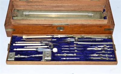 Lot 275 - Ivory drawing instruments in a oak and brass bound box