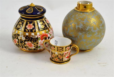 Lot 279 - A Royal Crown Derby Japan pattern pot pourri vase and cover, a similar miniature loving cup and...