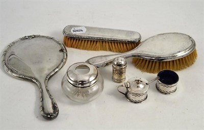 Lot 281 - A silver three piece cruet set, a silver dressing mirror, two brushes and a hair tidy