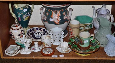 Lot 321 - A shelf of ceramics a Majolica stand, two large vases, relief moulded jugs, Prattware mug etc